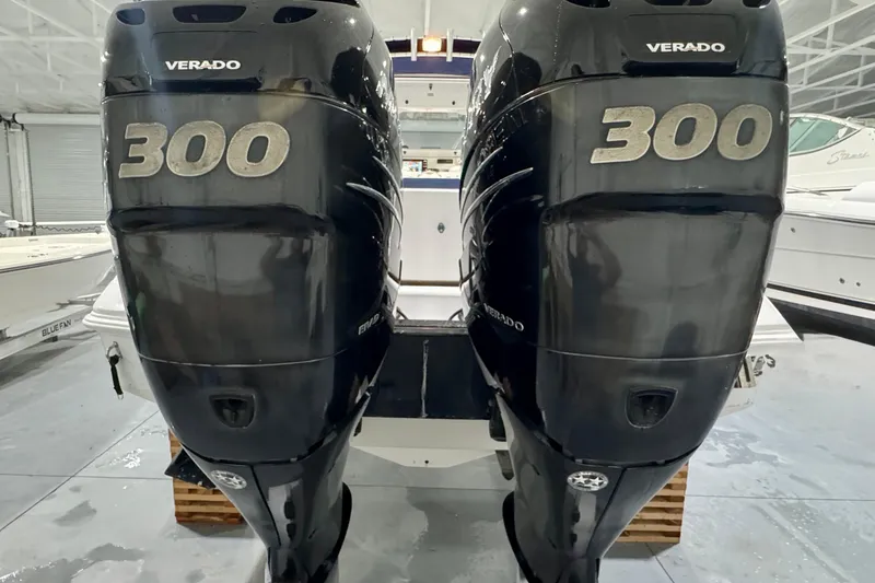 Slide: The Image of 2005 Donzi 32 ZF Open with twin Verado 300 engines in a boat garage. - 30