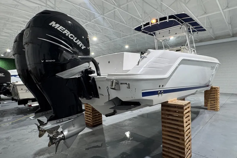 Slide: The Image of 2005 Donzi 32 ZF Open boat with Mercury outboard engines in a storage facility. - 7