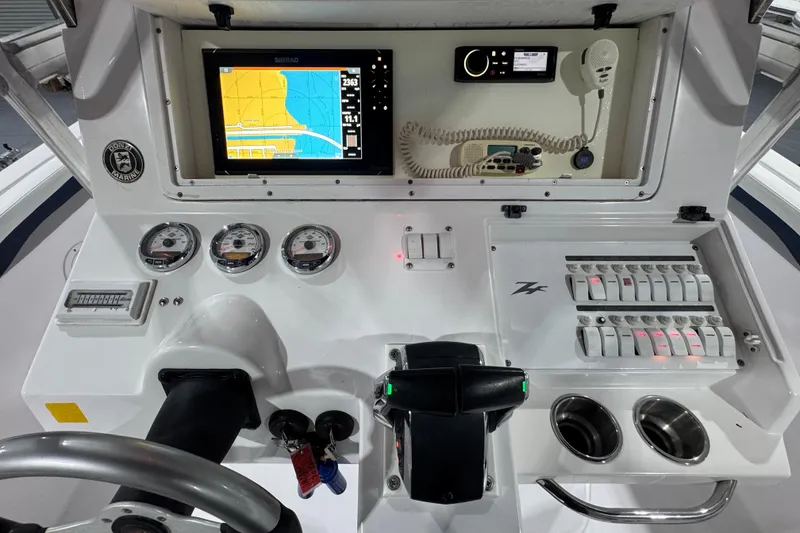 Slide: The Image of Dashboard of a 2005 Donzi 32 ZF Open boat with navigation and control systems. - 9