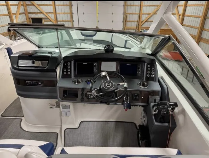 Slide: The Image of Interior view of 2021 Chaparral OSX 280 cockpit with controls. - 11