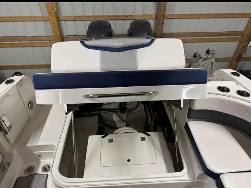Slide: The Image of 2021 Chaparral OSX 280 boat interior with open storage compartment. - 18
