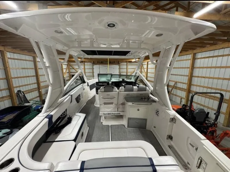 Slide: The Image of Interior view of a 2021 Chaparral OSX 280 boat in a garage. - 8