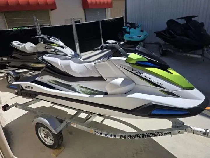 Slide: The Image of 2026 Yamaha WaveRunner VX Deluxe on trailer, white and green. - 6