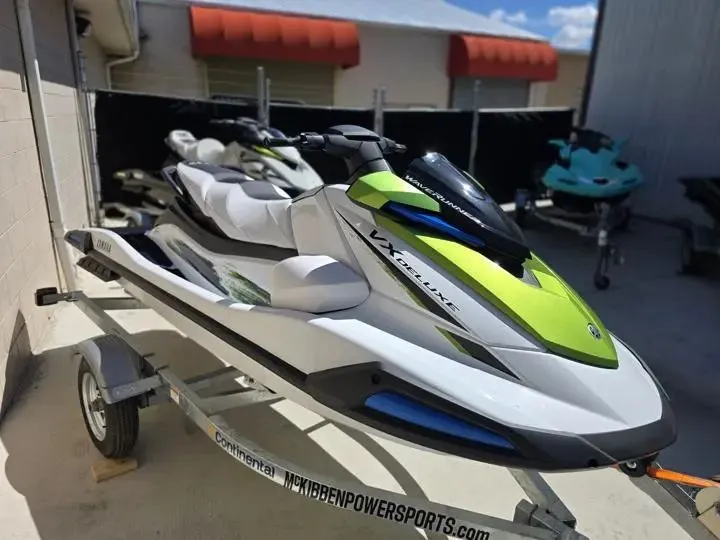 Slide: The Image of 2026 Yamaha WaveRunner VX Deluxe on trailer, green and white design. - 7