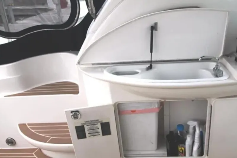 Slide: The Image of 2001 Sea Ray Sundancer 460 yacht interior with sink and storage cabinet. - 18