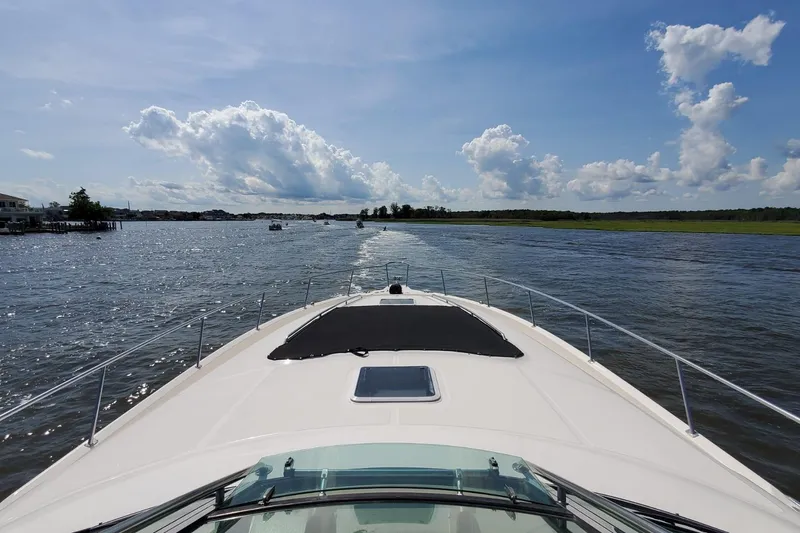 Slide: The Image of Bow view of 2001 Sea Ray Sundancer 460 cruising on a sunny day. - 21