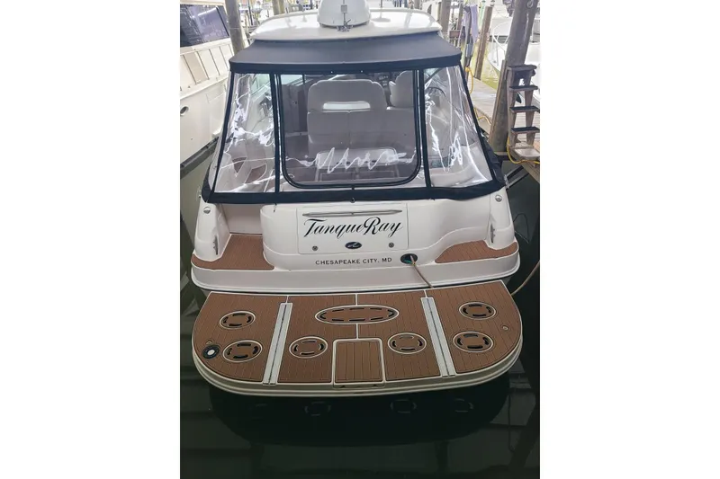 Slide: The Image of 2001 Sea Ray Sundancer 460 docked, rear view with teak deck and canopy. - 22