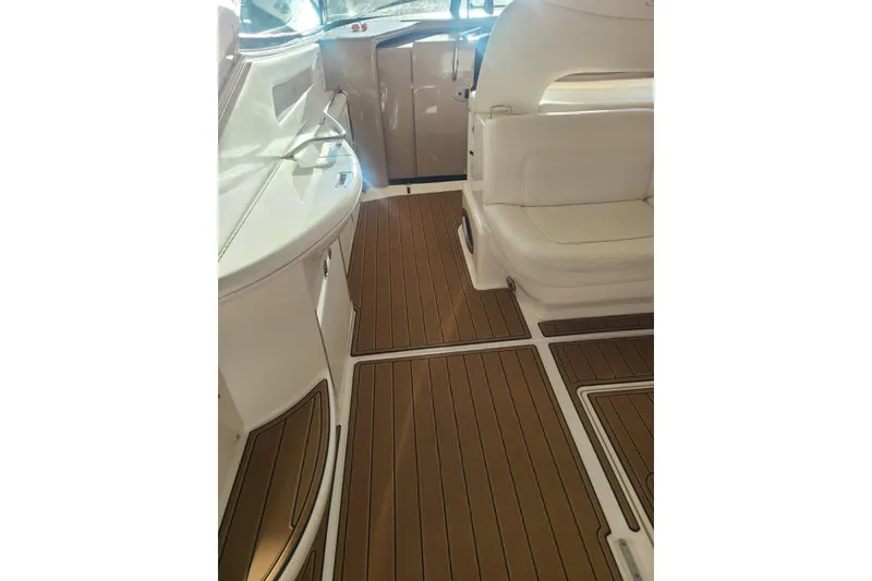 Slide: The Image of Interior of 2001 Sea Ray Sundancer 460 with sleek seating and wood-style flooring. - 24