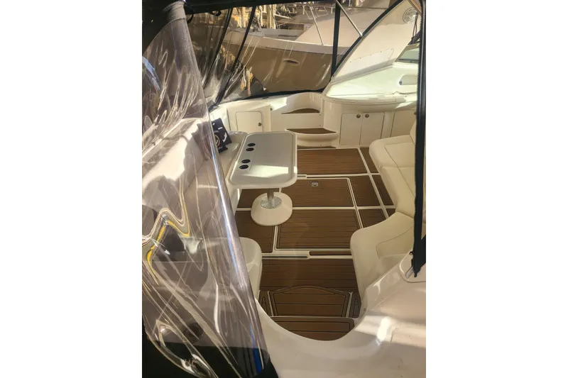Slide: The Image of 2001 Sea Ray Sundancer 460 interior with seating, table, and wood flooring. - 28