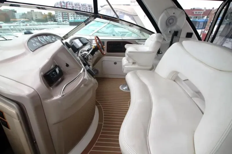 Slide: The Image of Luxurious 2001 Sea Ray Sundancer 460 yacht interior with plush seating and modern dashboard. - 29