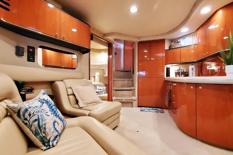 Slide: The Image of Luxurious interior of 2001 Sea Ray Sundancer 460 yacht with elegant seating and cabinetry. - 33