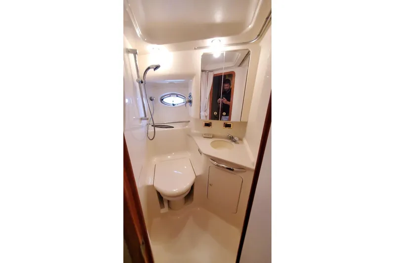 Slide: The Image of Bathroom interior of 2001 Sea Ray Sundancer 460 yacht, featuring shower and sink. - 35