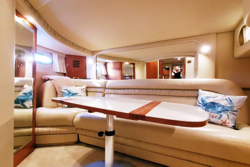 Slide: The Image of Luxurious interior of 2001 Sea Ray Sundancer 460 yacht with plush seating and nautical decor. - 38
