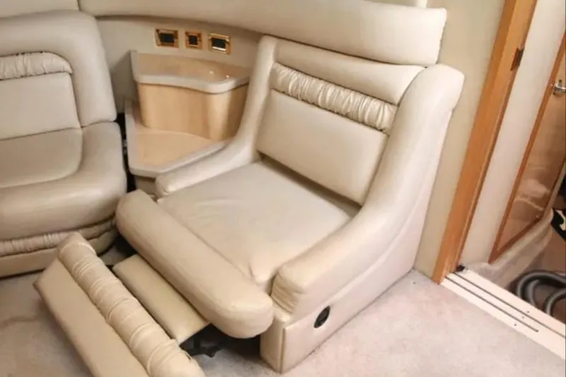 Slide: The Image of Luxurious interior seating of 2001 Sea Ray Sundancer 460 yacht, featuring plush beige upholstery. - 40