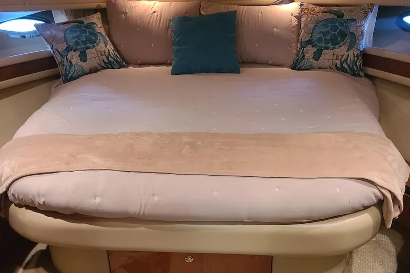 Slide: The Image of Cozy bedroom in 2001 Sea Ray Sundancer 460 yacht with turtle-themed pillows. - 42