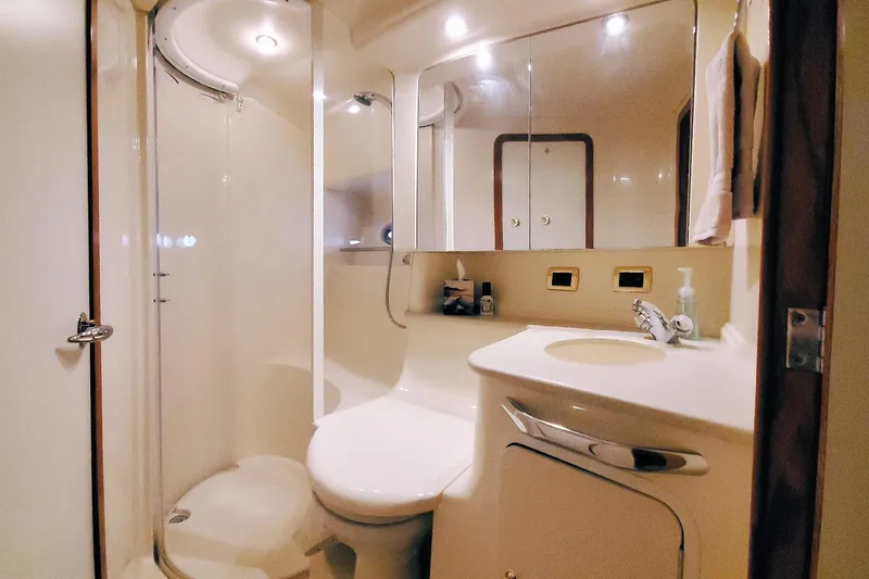 Slide: The Image of Luxurious bathroom in 2001 Sea Ray Sundancer 460 yacht, featuring modern amenities and elegant design. - 44