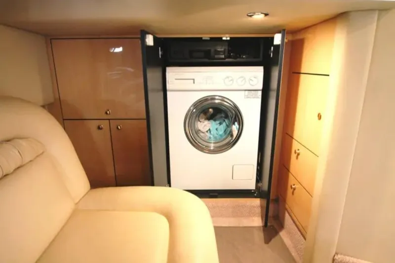 Slide: The Image of Interior of 2001 Sea Ray Sundancer 460 yacht with built-in washing machine. - 53