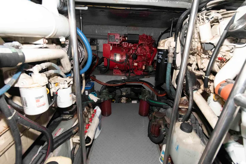 Slide: The Image of Engine room of 2001 Sea Ray Sundancer 460 yacht, showcasing mechanical components and systems. - 55