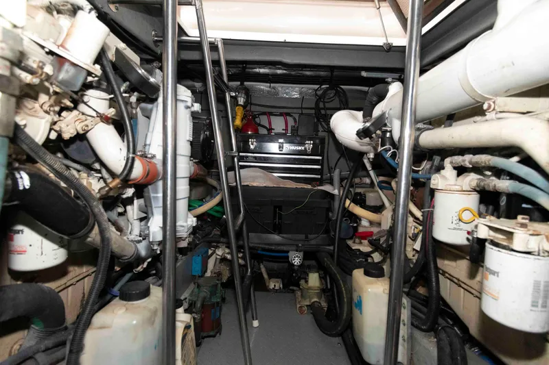 Slide: The Image of Engine room of a 2001 Sea Ray Sundancer 460 yacht, showcasing mechanical components and equipment. - 56