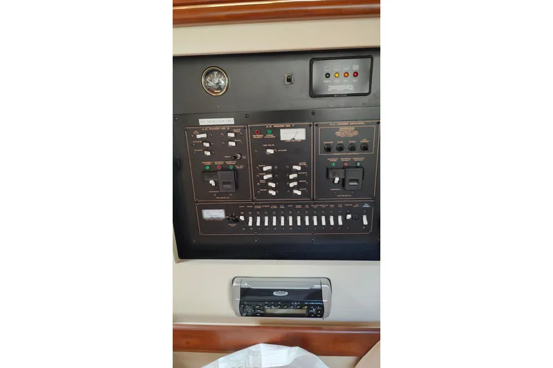 Slide: The Image of Control panel of a 2003 Cruisers Yachts 3470 Express boat. - 26