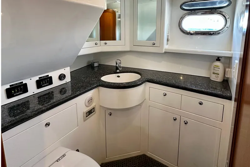 Slide: The Image of Luxurious bathroom in 2003 Nordhavn 47 yacht with granite countertop and modern fixtures. - 15
