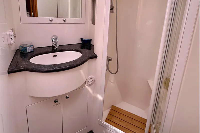 Slide: The Image of Bathroom interior of 2003 Nordhavn 47 yacht with sink and shower. - 18