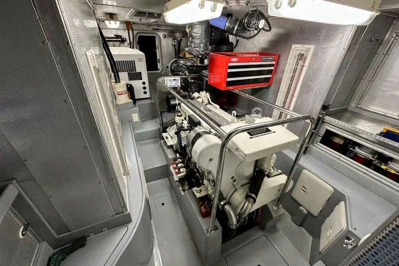 Slide: The Image of Engine room of 2003 Nordhavn 47 yacht, featuring Lugger engine and tool storage. - 19