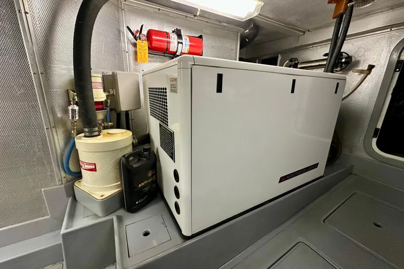 Slide: The Image of Engine room of 2003 Nordhavn 47 yacht with generator and fire extinguisher. - 20