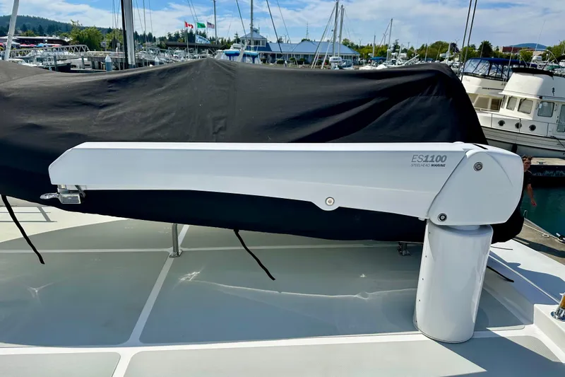 Slide: The Image of Nordhavn 47 yacht (2003) with Steelhead Marine ES1100 crane on deck, docked at marina. - 4