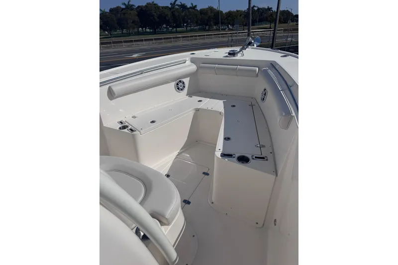 Slide: The Image of 2025 Sea Born SX239 Offshore boat interior with seating and storage compartments. - 15