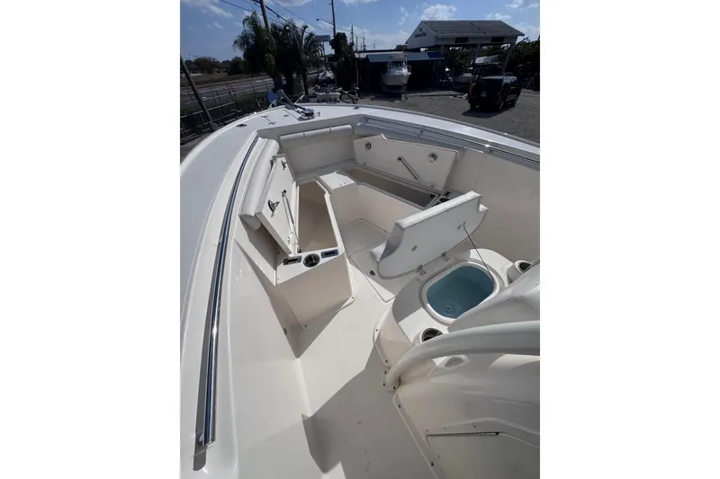 Slide: The Image of 2025 Sea Born SX239 Offshore boat interior with seating and storage compartments. - 16