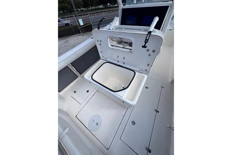 Slide: The Image of 2025 Sea Born SX239 Offshore boat with open storage compartment on deck. - 20