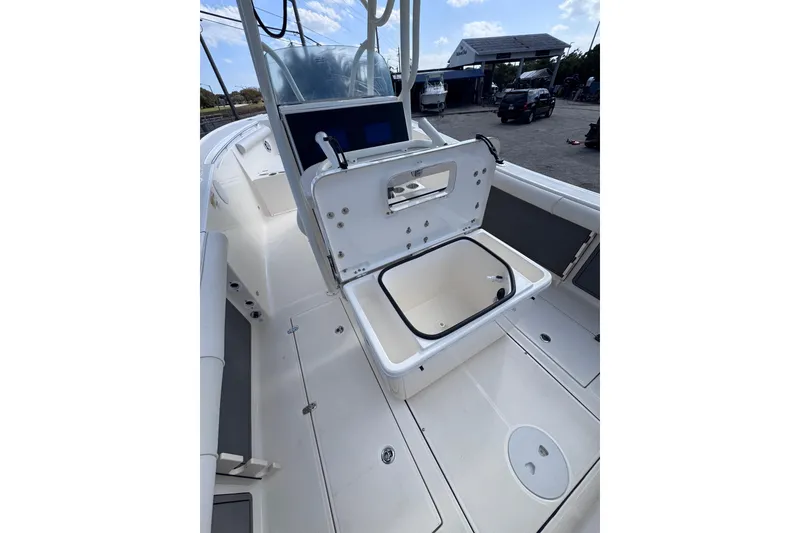 Slide: The Image of 2025 Sea Born SX239 Offshore boat interior with open storage compartment. - 21