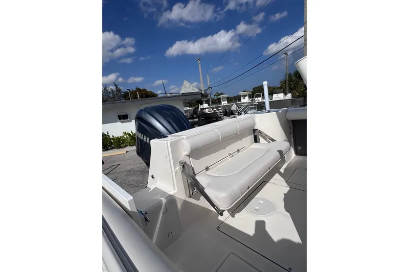 Slide: The Image of 2025 Sea Born SX239 Offshore boat with Yamaha engine, featuring a foldable rear seat. - 27