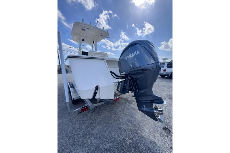 Slide: The Image of 2025 Sea Born SX239 Offshore boat with Yamaha outboard motor under a clear blue sky. - 7