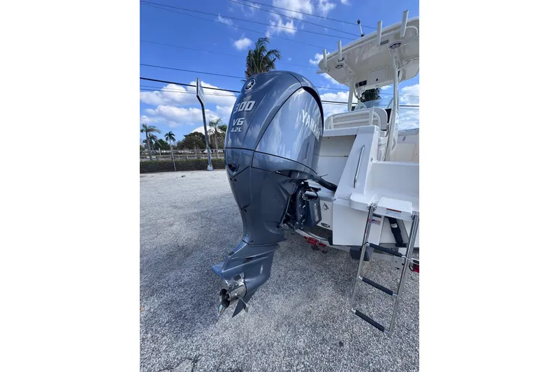 Slide: The Image of 2025 Sea Born SX239 Offshore boat with Yamaha V6 300 engine, parked outdoors. - 8
