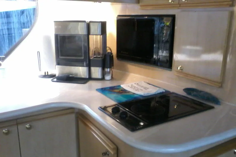Slide: The Image of Modern kitchen in 2000 Bluewater 5800 Millenium yacht with appliances and sleek countertops. - 13