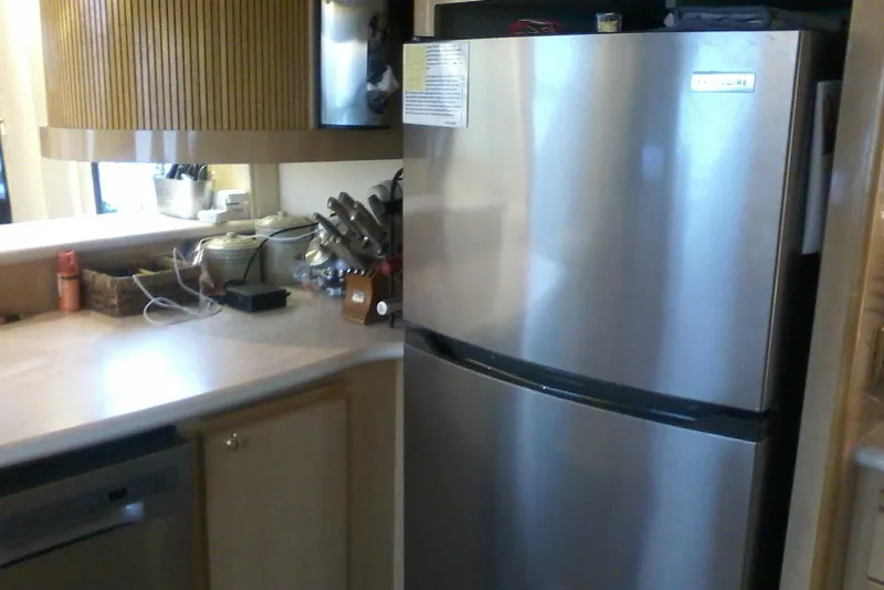 Slide: The Image of Kitchen interior with stainless steel fridge on Bluewater 5800 Millenium yacht, 2000 model. - 14