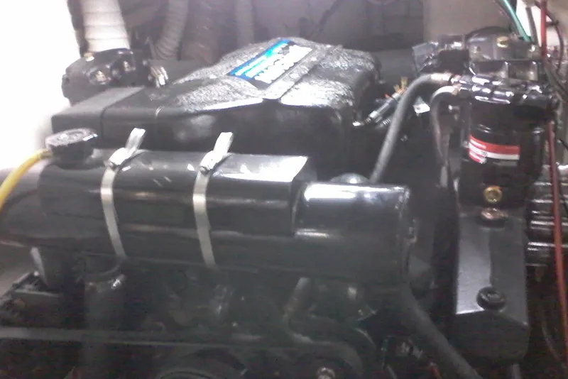 Slide: The Image of Engine of a 2000 Bluewater 5800 Millenium boat, showcasing mechanical components. - 20