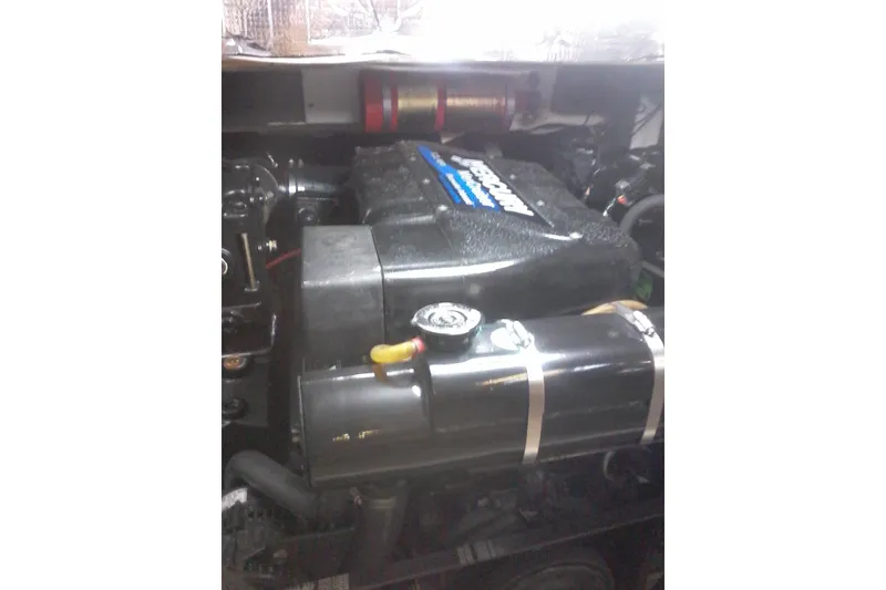 Slide: The Image of Engine compartment of a 2000 Bluewater 5800 Millenium boat, featuring a Mercruiser engine. - 21