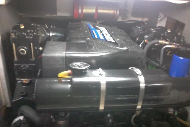 Slide: The Image of Engine compartment of a 2000 Bluewater 5800 Millenium boat, featuring a Mercury engine. - 23