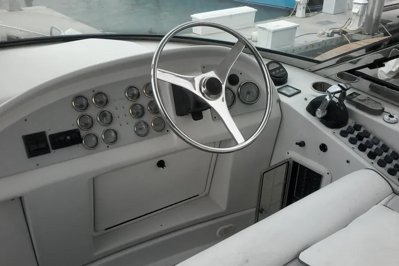 Slide: The Image of Steering wheel and dashboard of 2000 Bluewater 5800 Millenium yacht. - 33