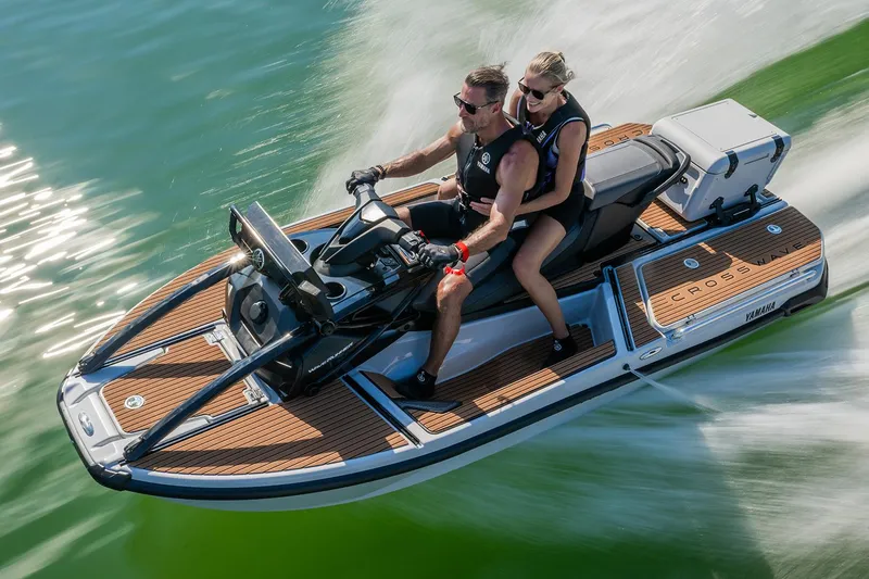 Slide: The Image of Manufacturer Provided Image: 2026 Yamaha WaveRunner Crosswave jet ski speeding on water with two riders. - 7