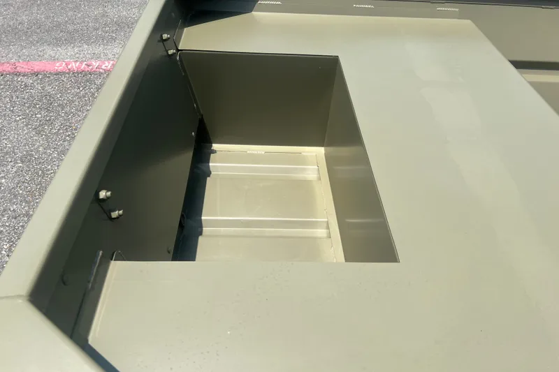 Slide: The Image of 2026 Tracker Grizzly 14 Jon boat interior detail, showcasing storage compartment. - 9