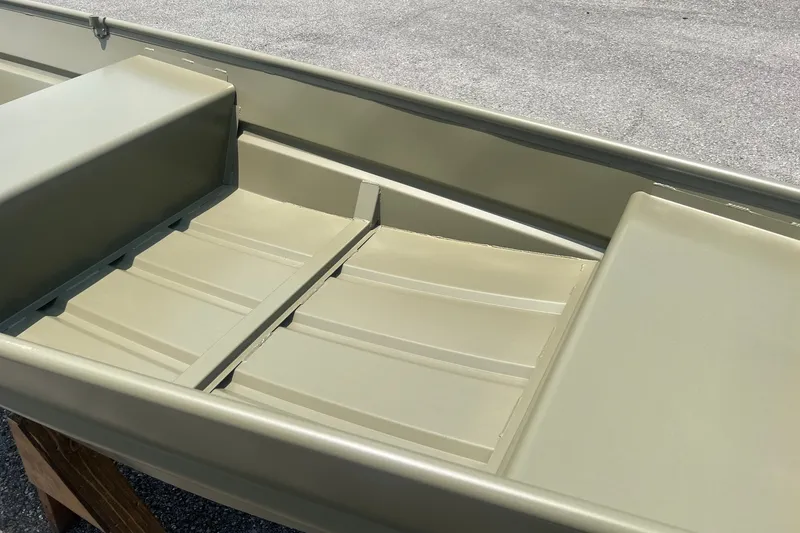 Slide: The Image of 2026 Tracker Grizzly 14 Jon boat interior, showcasing durable seating and spacious design. - 6