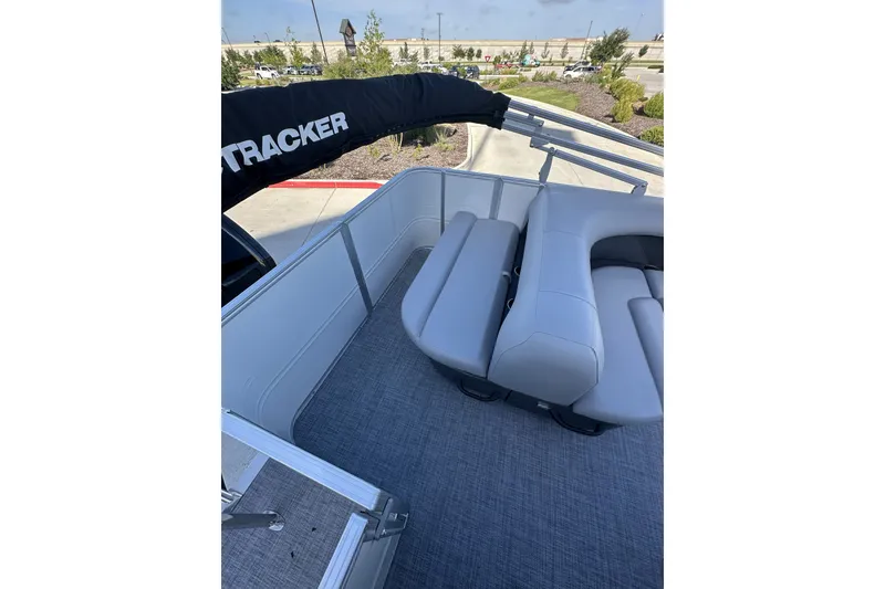 Slide: The Image of 2026 Sun Tracker Party Barge 16 DLX with gray seating and spacious deck area. - 31