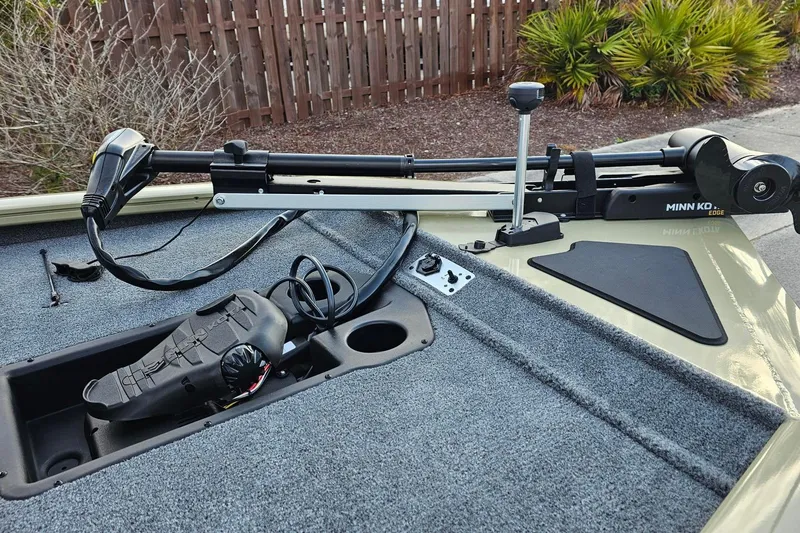 Slide: The Image of 2026 Tracker Pro Team 195 boat with Minn Kota trolling motor on deck. - 10