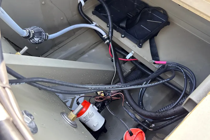Slide: The Image of Interior view of 2026 Tracker Grizzly 1754 SC boat showing wiring and components. - 20