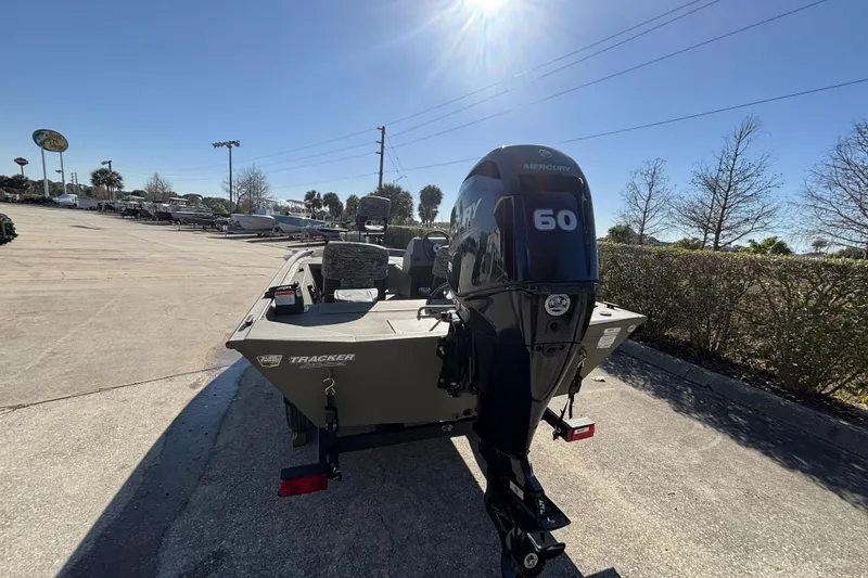 Slide: The Image of 2026 Tracker Grizzly 1754 SC boat with Mercury 60 engine in outdoor setting. - 5