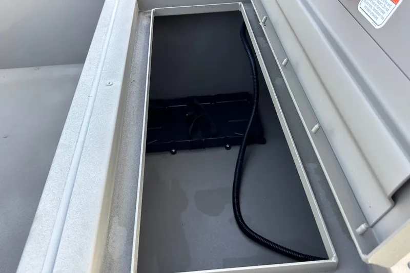 Slide: The Image of Storage compartment of 2026 Tracker Grizzly 1754 SC boat, featuring a sleek interior design. - 18
